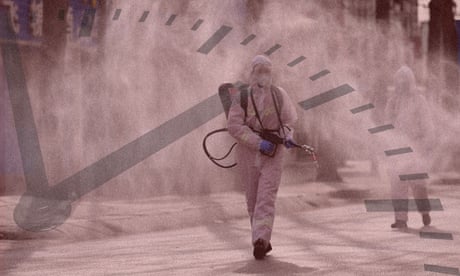 Person in hazmat suit spraying