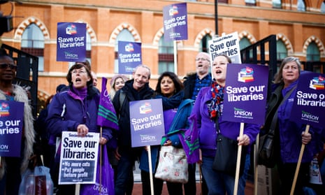 Protesters gather outside the British Library in London to march against government cuts to the arts and public libraries