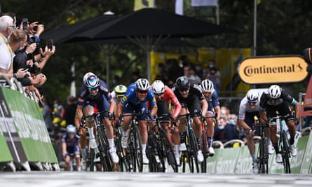 Mark Cavendish emerges from the pack to sprint clear on stage four.