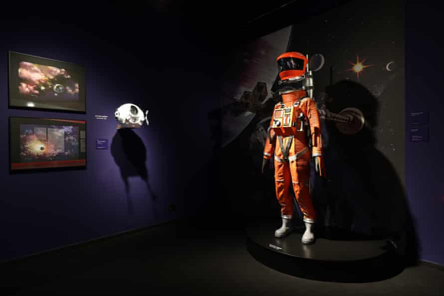 Prints of space and spacecrafts by Roy Carnon, and a space suit worn in 2001.