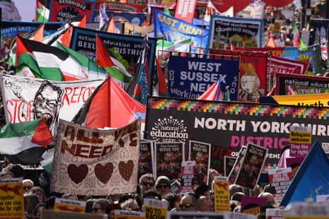 People take part in a Together Alliance march