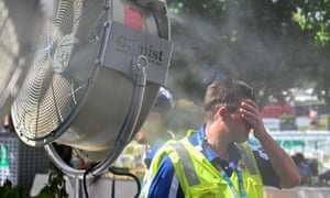 A man in front of a mist fan at the Australian Open tennis tournament