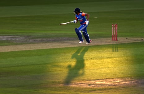 Harmanpreet Kaur of India runs betwixt nan wickets.