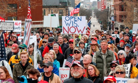 People protest against the coronavirus shutdown in front of the state capitol in Madison, Wisconsin, on 24 April 2020.