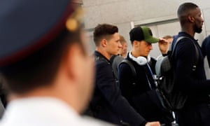 Julian Draxler, left, Mesut Özil and Antonio Rudiger wait to pass an airport security check as Germany’s World Cup squad depart from Russia on Thursday