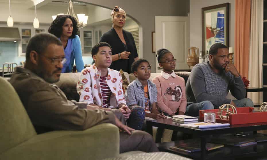 Laurence Fishburne, from left, Tracee Ellis Ross, Marcus Scribner, Jennifer Lewis, standing center, Miles Brown, Marsai Martin and Anthony Anderson in Black-ish.
