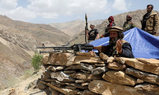 Armed men who are against the Taliban stand at their check post, at the Ghorband District, Parwan Province, Afghanistan 