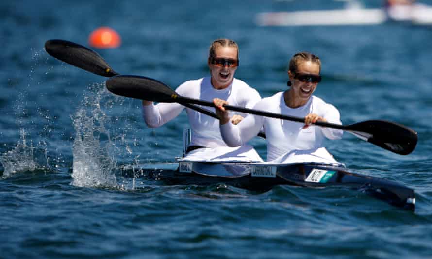 Lisa Carrington and Caitlin Regal celebrate at the end of the gold medal race.