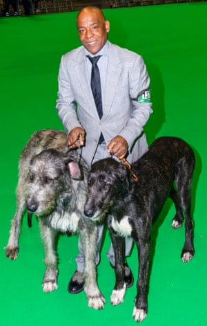 Chris Amoo, former Real Thing singer, with two wolfhounds at Crufts dog show 2019