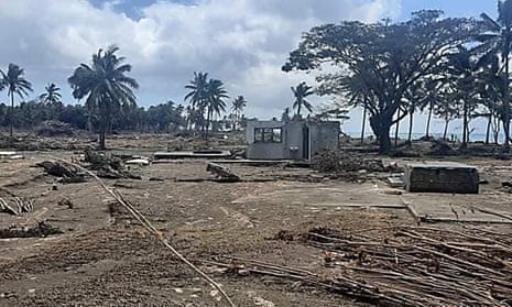 Photos emerging from Tonga have show buildings and trees flattened by the tsunami and covered in dust from the erupting volcano.