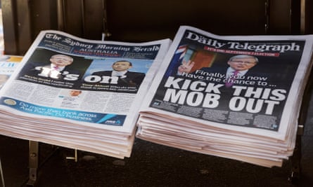 Rupert Murdoch’s Sydney Daily Telegraph newspaper (R), with the Fairfax Media’s Sydney Morning Herald newspaper (L), are displayed on a news stand in Sydney.