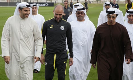 Manchester City’s chairman, Khaldoon Al Mubarak (left), and owner, Sheikh Mansour (right), chat with Pep Guardiola in Abu Dhabi