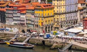 By the waterside: loading boats on the River Douro.