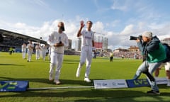 Stuart Broad waves to the crowd alongside Moeen Ali after England's win