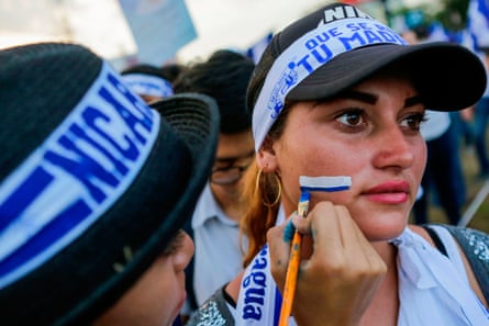 A student gets her face painted in the colours of the Nicaraguan flag during a protest against the government of President Daniel Ortega in Managua in May, 2018