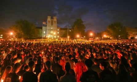 Virginia Tech students pass the flame of a memorial candle on the fifth anniversary of the 2007 shootings on the campus.
