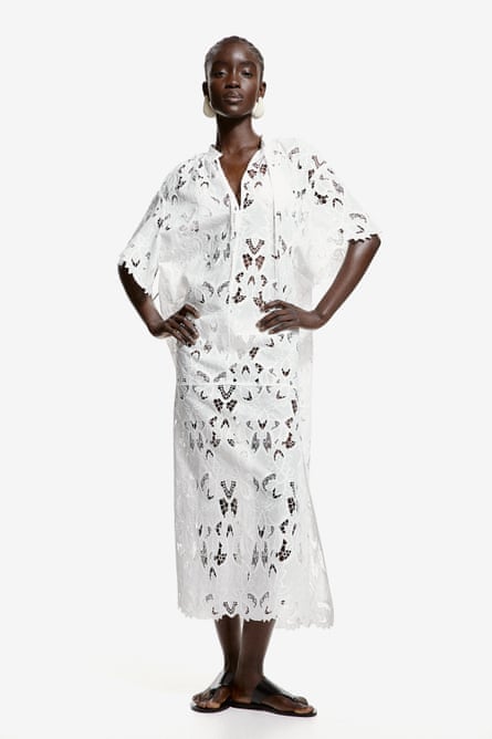 Model wearing white broderie anglaise kaftan