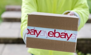 A courier delivering an eBay parcel to a customers front door. A courier delivering an eBay parcel to a customers front door.
