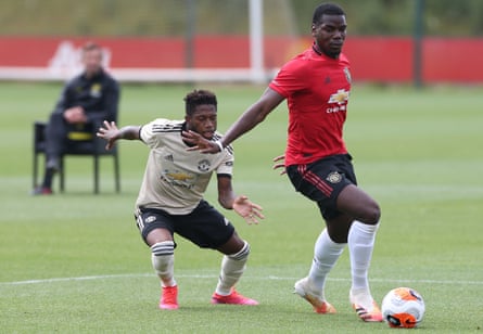 Paul Pogba shields the ball from Fred during a Manchester United first team training session ahead of the return of Premier League football in June 2020.