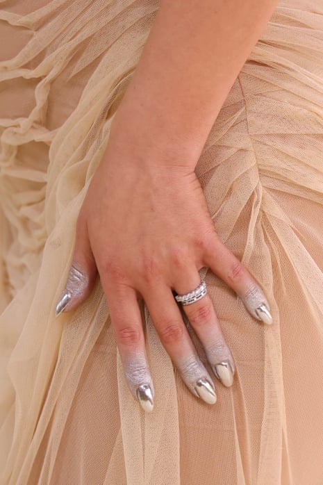close-up of woman’s silver nails