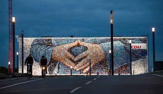 An election billboard featuring Merkel’s rhombus-shape hands gesture, in Berlin in September 2013