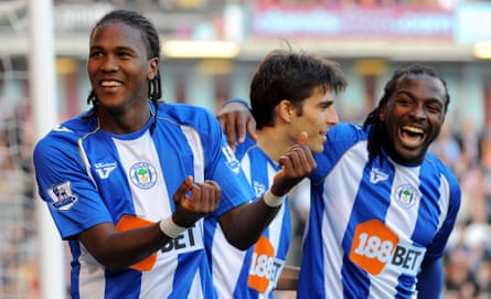 Hugo Rodallega celebrates with team-mates Jason Scotland and Jordi Gomez after scoring against Burnley in 2009.
