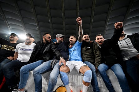 Lazio's Mattia Zaccagni celebrates with fans after the match.