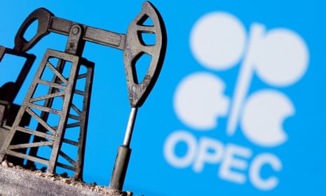 A 3D-printed oil pump jack in front an OPEC logo