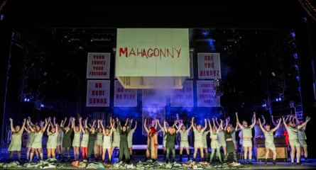 ‘Costumes like the spoils from a charity-shop sweep’… the ENO chorus nailing it at London Coliseum.