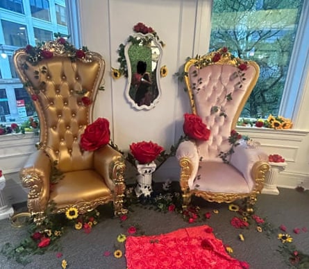 Plasticky thrones covered in flower petals on an office-type carpet