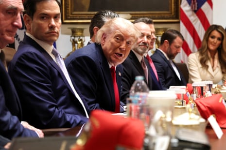 Donald Trump and other US officials sat at a table during a cabinet meeting at the White House.
