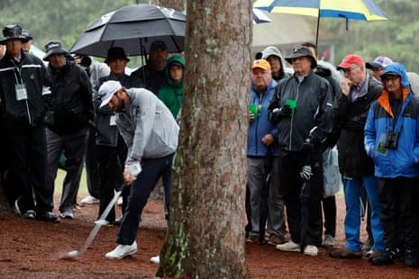 Cameron Young hits his approach from the trees on the 13th hole during his second round.