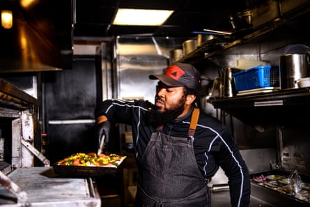 Chef Michael Carter puts a pizza in the oven at Down North Pizza in Philadelphia on Thursday, September 21, 2023.