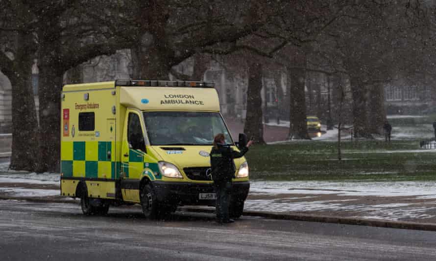 Ambulance staff attend an emergency in snowfall in London – the measures taken to bring down the R number of Sarx-CoV-2 have almost eliminated seasonal flu.