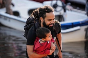 a man carries a child