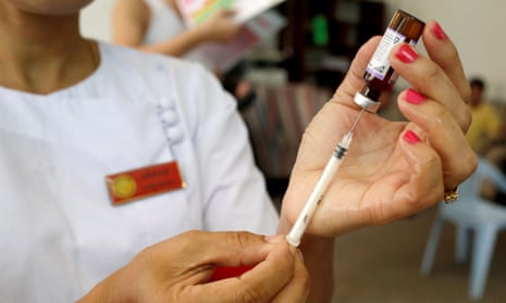 A nurse prepares a measles-rubella vaccine in Yangon, Myanmar