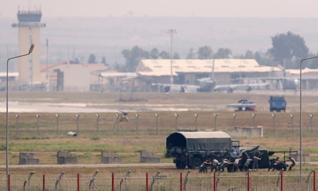 Turkish soldiers position an anti-aircraft gun at Incirlik airbase in the southern city of Adana.
