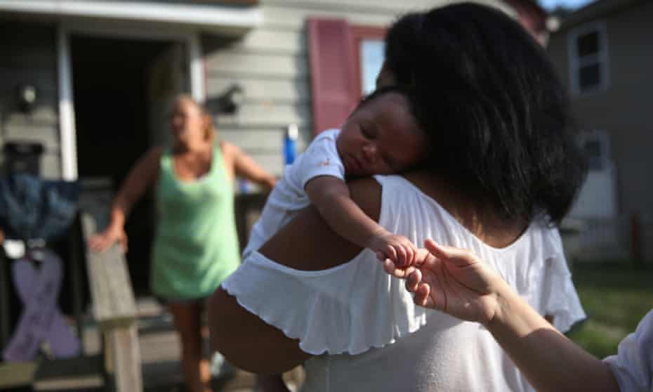 Homeless grandmother Valencia Terrell arrives with her grandchild to stay temporarily at a friend’s home on 26 August 2015 in Atlantic City, New Jersey.