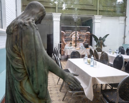 A cafe with a religious statue in the corner