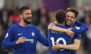 Cesc Fàbregas hugs Eden Hazard as Olivier Giroud joins the celebrations after the midfielder’s classy winner against Swansea.