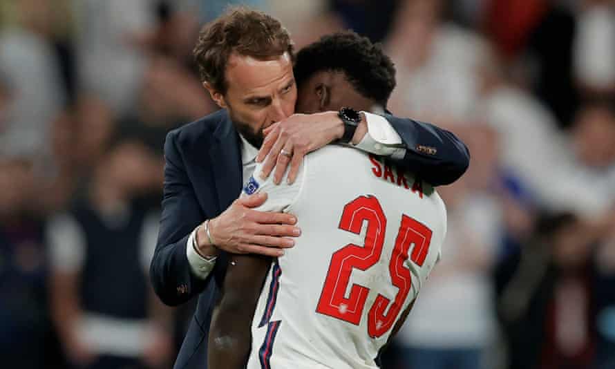 Gareth Southgate hugs Bukayo Saka after the Euro 2020 final defeat by Italy.