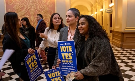 Califiornia state senator Aisha Wahab, center, with Thenmozhi Soundararajan, right, promote a bill which adds caste as a protected category in the state’s anti-discrimination laws, in Sacramento in March.
