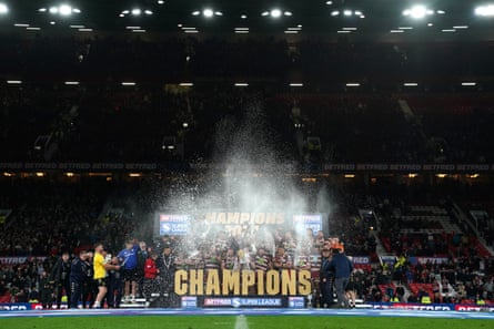 Wigan Warriors players celebrate winning the 2024 Super League Grand Final