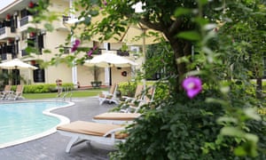 View of the pool and in the background the accommodation block at the Phu Thinh Boutique Resort, Hoi An, Vietnam.