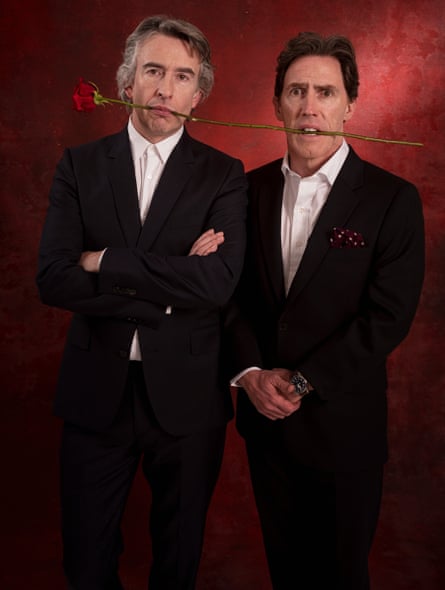 Rob Brydon and Steve Coogan holding a rose between their teeth