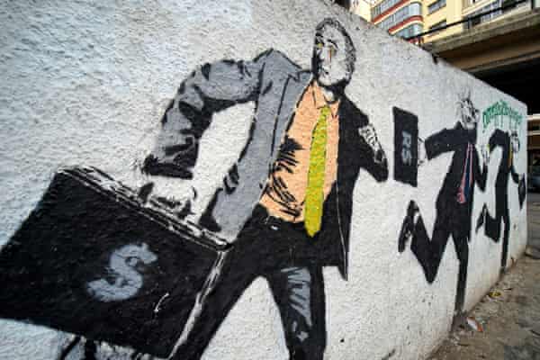 Graffiti with the image of President Michel Temer running with a suitcase of money in central Sao Paulo.