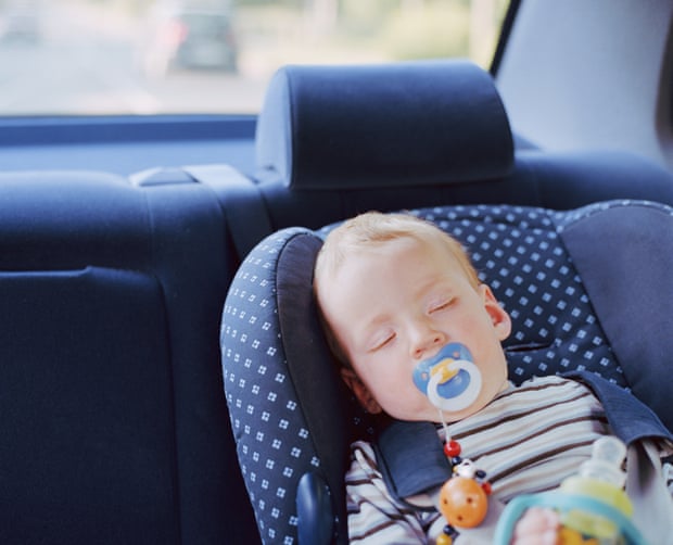 Baby boy (6-9 months) sleeping in car seat