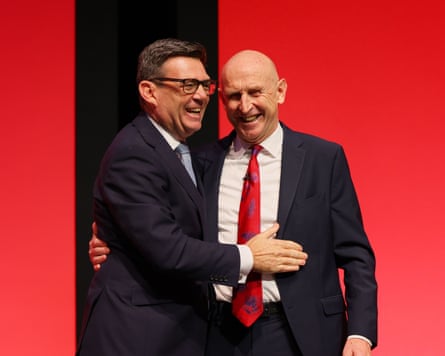 Burnham and Healey embrace on stage at Labour party conference