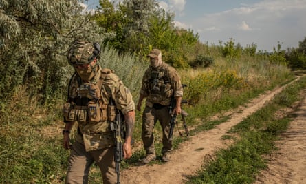 Alan, a British fighter, and Steve, an American, who both joined the Da Vinci Wolves group, at a shooting range outside Dnipro.