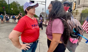 A Trump supporter and a Black Lives Matter protester face off in Kenosha.